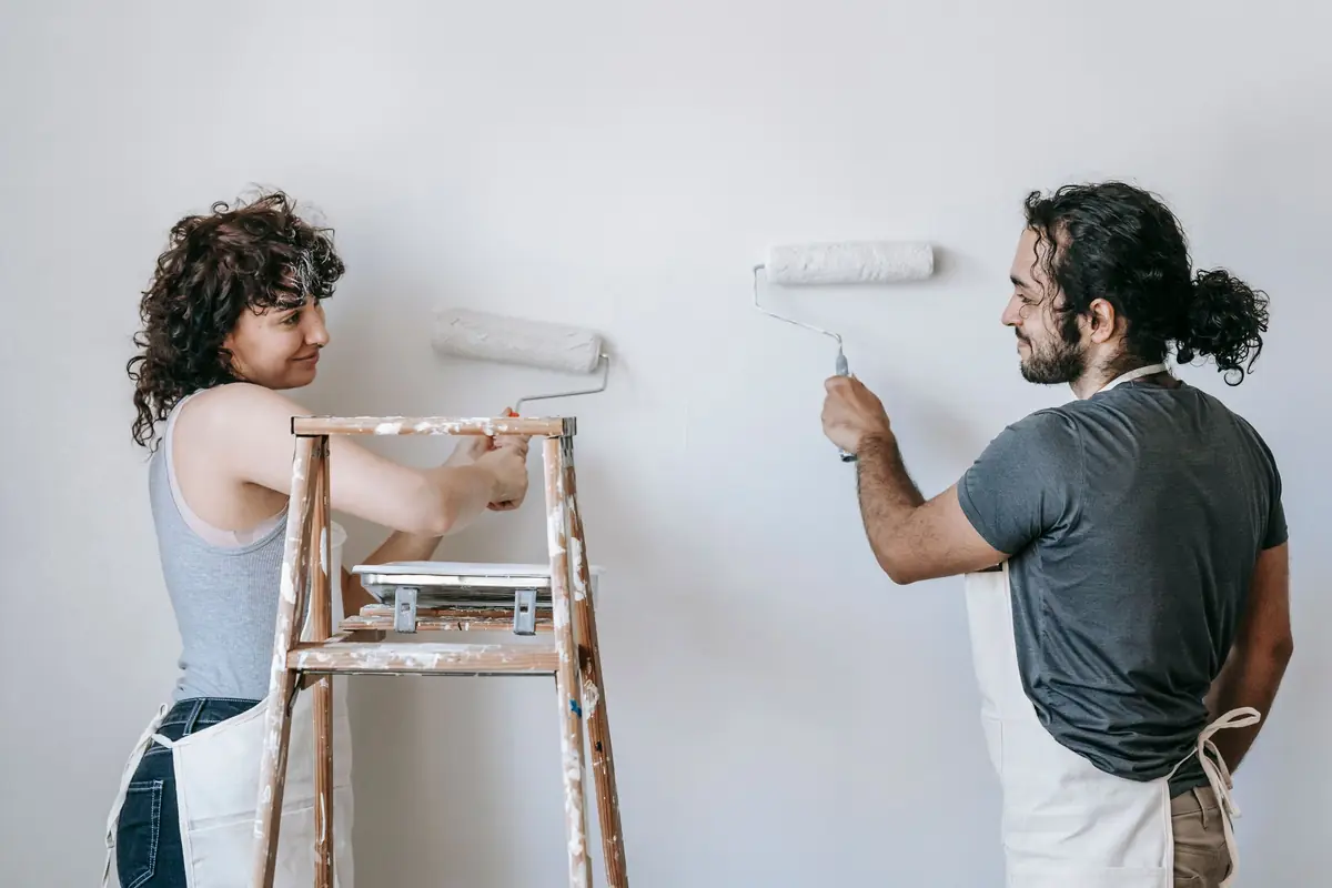 People painting a wall together — painting help in Fremont
